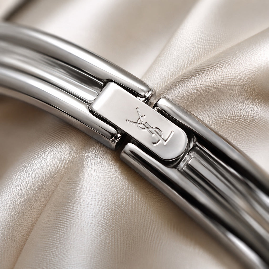 Yves Saint Laurent bangle z niebieską tarczą